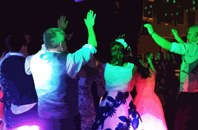 Photo of people dancing at a wedding with DJ Nick Arkell