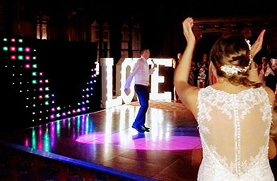 Photo of a Manchester Town Hall wedding with groom singing